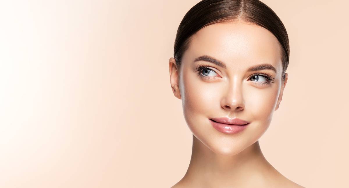 Young woman with natural results and expressions after a brow lift.